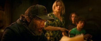 Movie still from “A Quiet Place Part II” (2020), directed by John Krasinski – A man and a woman are sitting at a table; Medium shot, Over the shoulder angle