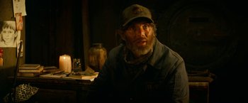 Movie still from “A Quiet Place Part II” (2020), directed by John Krasinski – A man with a beard wearing a hat and jacket; Close Up shot, Low angle