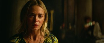 Movie still from “A Quiet Place Part II” (2020), directed by John Krasinski – A person wearing a yellow and blue dress; Close Up shot, Over the shoulder angle