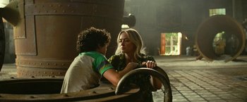 Movie still from “A Quiet Place Part II” (2020), directed by John Krasinski – A woman and a boy sitting next to each other on a bench; Medium shot, Over the shoulder angle
