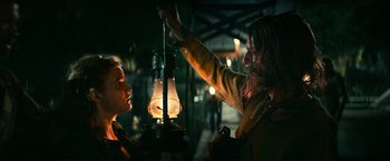 Movie still from “A Quiet Place Part II” (2020), directed by John Krasinski – A man and a woman standing next to each other; Medium shot, Over the shoulder angle