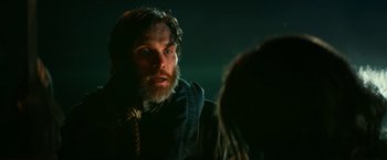 Movie still from “A Quiet Place Part II” (2020), directed by John Krasinski – A man with a beard is talking to a woman; Close Up shot, Over the shoulder angle