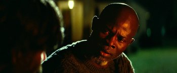 Movie still from “A Quiet Place Part II” (2020), directed by John Krasinski – A man with a beard is looking down at his face; Close Up shot, Over the shoulder angle