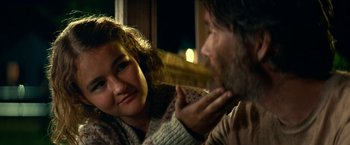 Movie still from “A Quiet Place Part II” (2020), directed by John Krasinski – A man and a woman sitting next to each other on a couch; Close Up shot, Over the shoulder angle