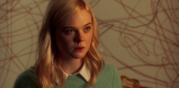 Movie still from “A Rainy Day in New York” (2019), directed by Woody Allen – A girl with blonde hair and a green sweater; Close Up shot, Over the shoulder angle