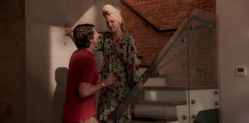 Movie still from “A Rainy Day in New York” (2019), directed by Woody Allen – A man and a woman standing next to each other on steps; Medium shot, High angle