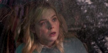 Movie still from “A Rainy Day in New York” (2019), directed by Woody Allen – A young girl looking out of a car window; Close Up shot, Over the shoulder angle