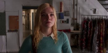 Movie still from “A Rainy Day in New York” (2019), directed by Woody Allen – A woman with blonde hair wearing a blue sweater; Close Up shot, Low angle