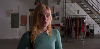 Movie still from “A Rainy Day in New York” (2019), directed by Woody Allen – A woman with blonde hair and a blue sweater; Medium shot, Over the shoulder angle