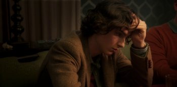 Movie still from “A Rainy Day in New York” (2019), directed by Woody Allen – A young man sitting in front of a mirror; Close Up shot, High angle