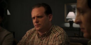 Movie still from “A Rainy Day in New York” (2019), directed by Woody Allen – A person wearing a plaid shirt; Close Up shot, Low angle