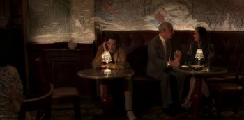 Movie still from “A Rainy Day in New York” (2019), directed by Woody Allen – A man and a woman sitting at a table in a restaurant; Wide shot, Over the shoulder angle