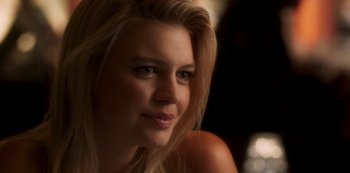 Movie still from “A Rainy Day in New York” (2019), directed by Woody Allen – A beautiful blond woman with a smile on her face; Close Up shot, Over the shoulder angle