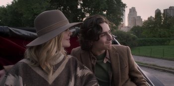 Movie still from “A Rainy Day in New York” (2019), directed by Woody Allen – A man and a woman sitting next to each other; Medium shot, Over the shoulder angle
