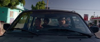 Movie still from “A Thousand Junkies” (2017), directed by Tommy Swerdlow – A group of people in a car on the street; Medium shot, Low angle