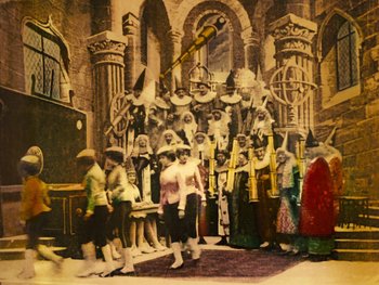 Movie still from “A Trip to the Moon” (1902), directed by Georges Méliès – A group of people standing in front of a building; Extreme Wide shot, Low angle