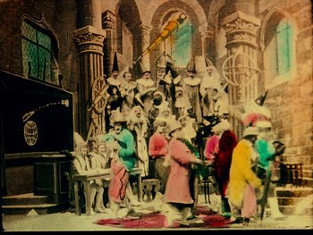 Movie still from “A Trip to the Moon” (1902), directed by Georges Méliès – A group of people dressed up in costumes; Extreme Wide shot, High angle