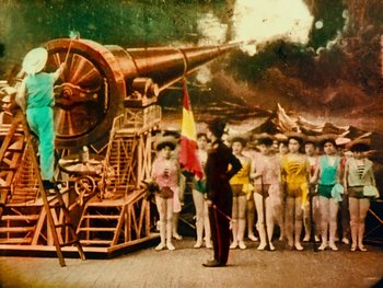 Movie still from “A Trip to the Moon” (1902), directed by Georges Méliès – A group of people standing next to each other in front of a large telescope; Extreme Wide shot, Low angle