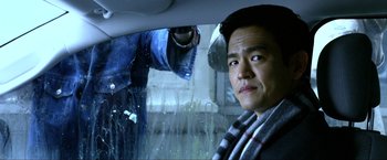 Movie still from “A Very Harold & Kumar Christmas” (2011), directed by Todd Strauss-Schulson – A man in the back of a car looking out the window; Close Up shot, Over the shoulder angle