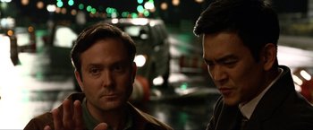 Movie still from “A Very Harold & Kumar Christmas” (2011), directed by Todd Strauss-Schulson – Two men standing next to each other on the street; Close Up shot, Over the shoulder angle