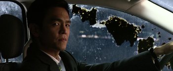 Movie still from “A Very Harold & Kumar Christmas” (2011), directed by Todd Strauss-Schulson – A man sitting in the back seat of a car; Close Up shot, Over the shoulder angle