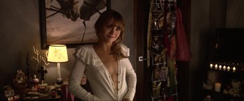 Movie still from “A Very Harold & Kumar Christmas” (2011), directed by Todd Strauss-Schulson – A woman standing in front of a wall of shoes; Close Up shot, Over the shoulder angle