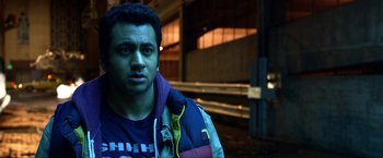 Movie still from “A Very Harold & Kumar Christmas” (2011), directed by Todd Strauss-Schulson – A person wearing a jacket; Close Up shot, Over the shoulder angle