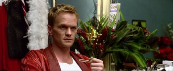 Movie still from “A Very Harold & Kumar Christmas” (2011), directed by Todd Strauss-Schulson – Neil patrick harris in a scene from the television show " how i met your mother; Close Up shot, High angle