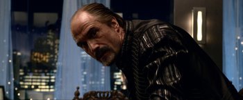 Movie still from “A Very Harold & Kumar Christmas” (2011), directed by Todd Strauss-Schulson – A person wearing a suit and tie; Close Up shot, Over the shoulder angle