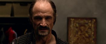 Movie still from “A Very Harold & Kumar Christmas” (2011), directed by Todd Strauss-Schulson – A person with a beard and mustache; Close Up shot, Over the shoulder angle