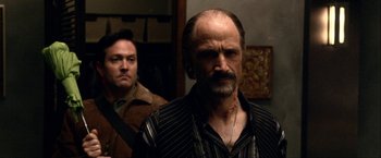 Movie still from “A Very Harold & Kumar Christmas” (2011), directed by Todd Strauss-Schulson – A man with a beard and mustache and a man with a beard and mustache; Close Up shot, Over the shoulder angle