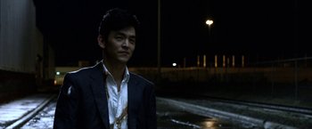 Movie still from “A Very Harold & Kumar Christmas” (2011), directed by Todd Strauss-Schulson – A man standing in the middle of the street at night; Close Up shot, Over the shoulder angle