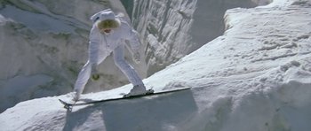 Movie still from “A View to a Kill” (1985), directed by John Glen – A person on a snow board going down a ramp; Wide shot, High angle