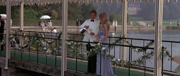 Movie still from “A View to a Kill” (1985), directed by John Glen – A man and a woman standing next to each other; Wide shot, High angle