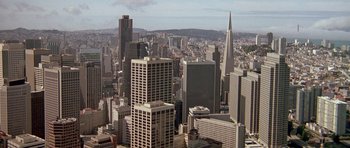 Movie still from “A View to a Kill” (1985), directed by John Glen – An aerial view of a city with skyscrapers; Extreme Wide shot, High angle