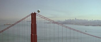 Movie still from “A View to a Kill” (1985), directed by John Glen – A view of the golden gate bridge from a distance; Extreme Wide shot, Low angle