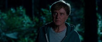 Movie still from “A Walk in the Woods” (2015), directed by Ken Kwapis – An older man in a green jacket looking at the camera; Close Up shot, Over the shoulder angle