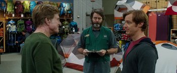 Movie still from “A Walk in the Woods” (2015), directed by Ken Kwapis – A man in a green shirt is holding an umbrella; Medium shot, Over the shoulder angle