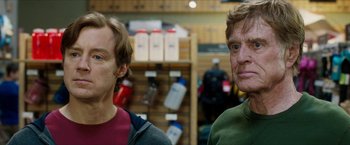 Movie still from “A Walk in the Woods” (2015), directed by Ken Kwapis – Two men standing next to each other in a store; Close Up shot, Low angle