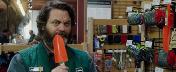 Movie still from “A Walk in the Woods” (2015), directed by Ken Kwapis – A man holding an orange shovel in his hand; Close Up shot, Over the shoulder angle