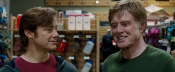 Movie still from “A Walk in the Woods” (2015), directed by Ken Kwapis – Two men are talking in a store; Close Up shot, Over the shoulder angle