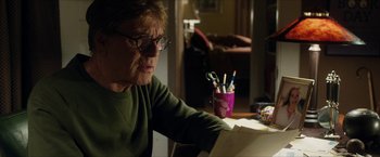 Movie still from “A Walk in the Woods” (2015), directed by Ken Kwapis – An older woman sitting at a table looking at a book; Close Up shot, Low angle