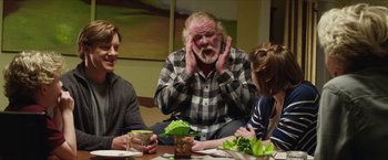 Movie still from “A Walk in the Woods” (2015), directed by Ken Kwapis – An older man sitting at a table with two young people; Medium shot, Over the shoulder angle