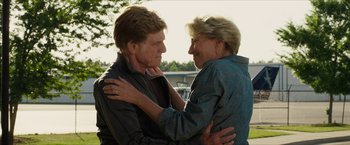 Movie still from “A Walk in the Woods” (2015), directed by Ken Kwapis – A man and a woman embracing each other outside; Medium shot, Low angle