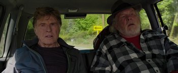 Movie still from “A Walk in the Woods” (2015), directed by Ken Kwapis – Two men sitting in the back seat of a car; Medium shot, Low angle