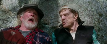 Movie still from “A Walk in the Woods” (2015), directed by Ken Kwapis – Two older men are sitting next to each other; Medium shot, Low angle