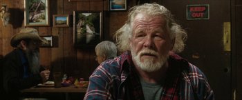 Movie still from “A Walk in the Woods” (2015), directed by Ken Kwapis – An old man with a long white beard and a plaid shirt; Close Up shot, Over the shoulder angle