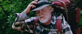 Movie still from “A Walk in the Woods” (2015), directed by Ken Kwapis – An older man wearing a hat and a backpack; Close Up shot, Low angle