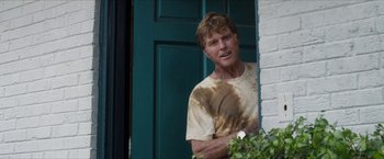 Movie still from “A Walk in the Woods” (2015), directed by Ken Kwapis – A man standing in front of a green door; Medium shot, Over the shoulder angle