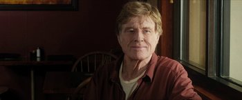 Movie still from “A Walk in the Woods” (2015), directed by Ken Kwapis – An older man wearing a brown shirt and a white shirt; Close Up shot, Low angle